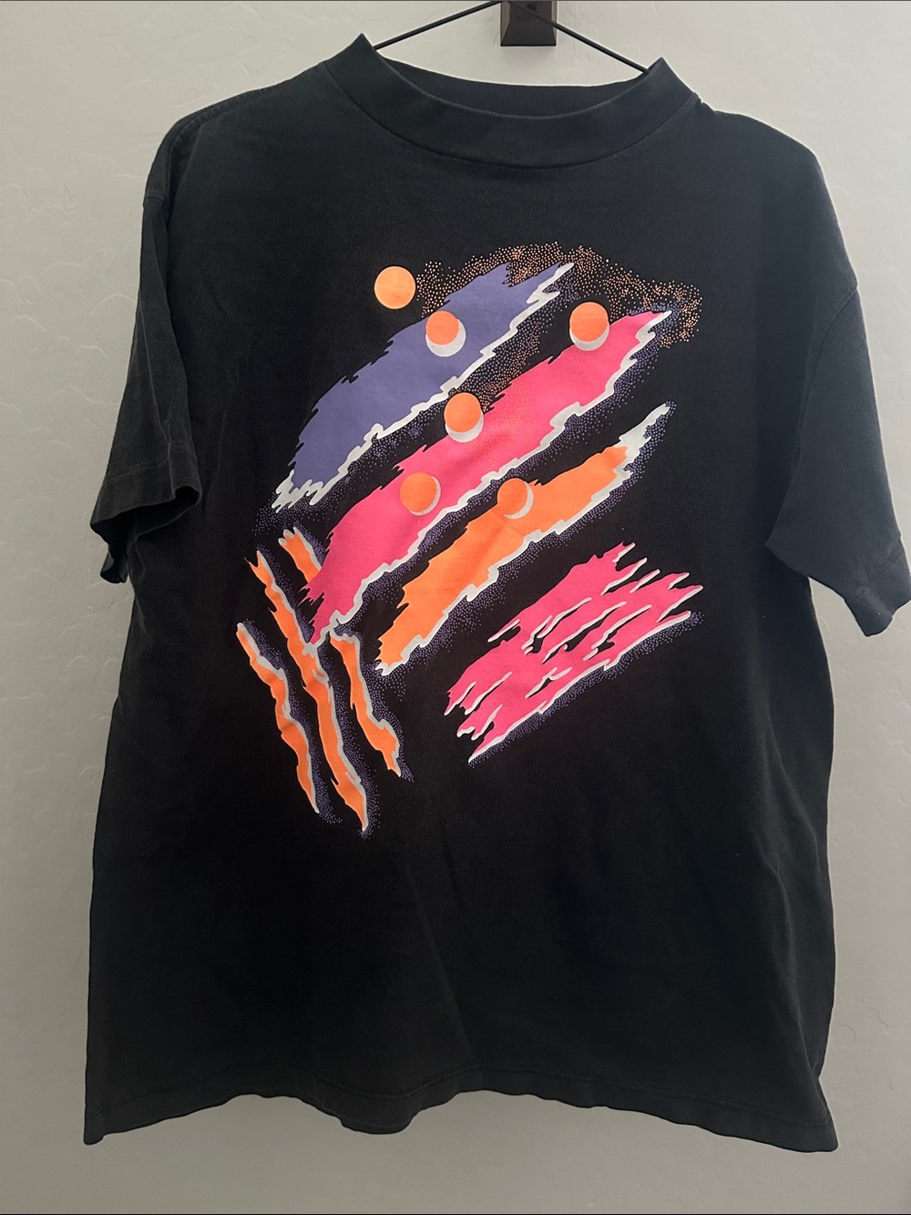 Vintage 90’s Black Short-Sleeve Graphic Tee with Neon Pink & Orange Accents
